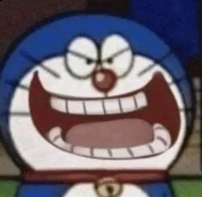 ảnh meme mèo máy Doraemon cười ranh mãnh